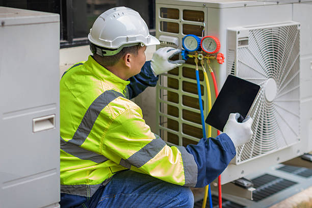 Professional Heat Pump Repair technician working in Cotuit, MA